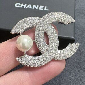 Chanel brooches